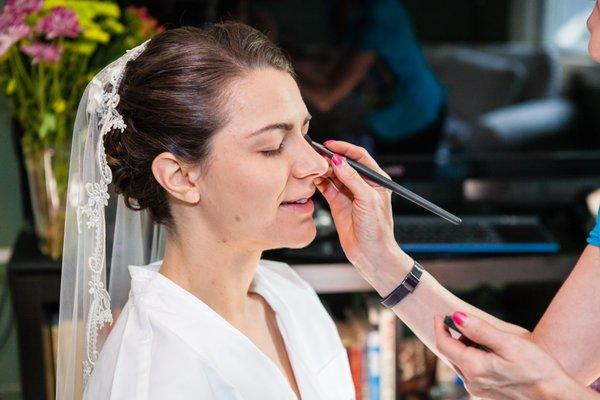 Starting a gentle & natural bridal look for Caitlin. Photo by Maria Linz Photography.