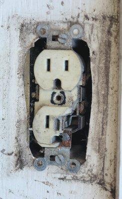 It's a non outdoor rated outlet, causing the components to fail internally over a period of time. Until it overheated and shorted out.