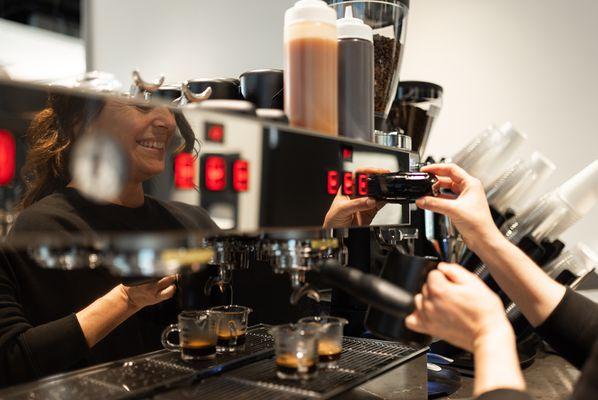 Barista steaming milk