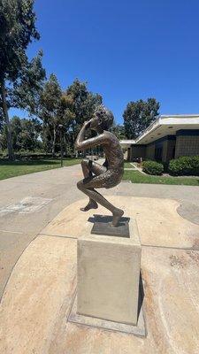 Boy jumping in the pool statue