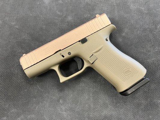 New Glock 43x w/Rose gold slide and FDE frame.  We do a lot of guns like this and can get them custom duracoated.