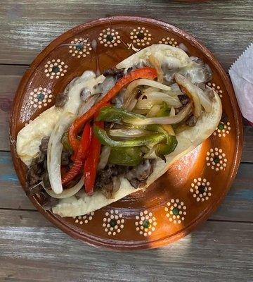 Philly Cheesesteak Sandwich: Steak, cheese, sliced red & green peppers, onions