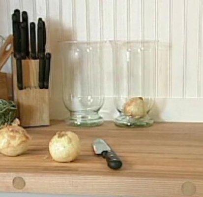 Butcher Block Countertop Paired with White Beadboard Backsplash in a Renovation of an 1898 Kitchen.