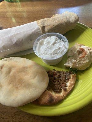 The Shawarma, hummus and fresh pita are delicious. Also pictured is Armenian pizza (Lahmajoun) and garlic paste.