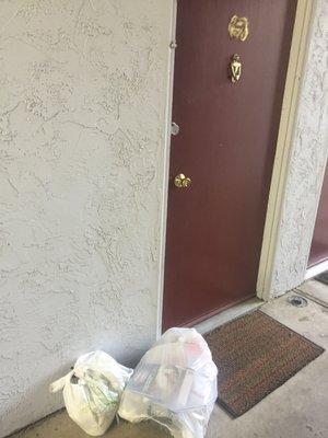 Trash left in front of apartment door is common.