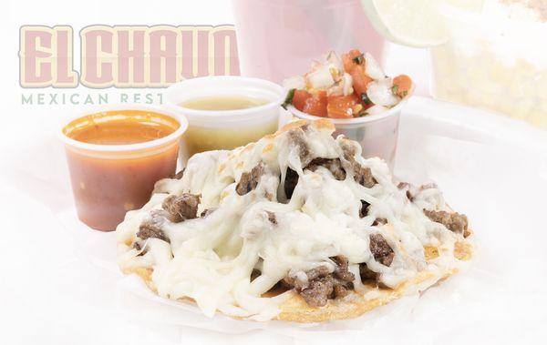 Volcan! An eruption of melted Chihuahua cheese from a mountain of grilled marinated steak on a crispy-fried tortilla.