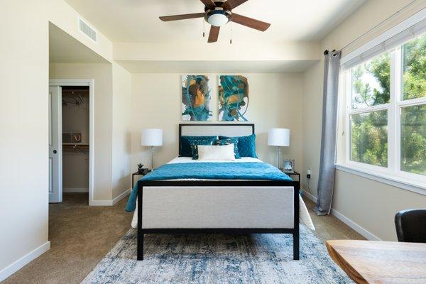 Bedroom with carpet flooring and a ceiling fan