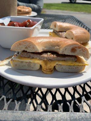 Sausage, egg and cheese breakfast sandwich with a side of home fries