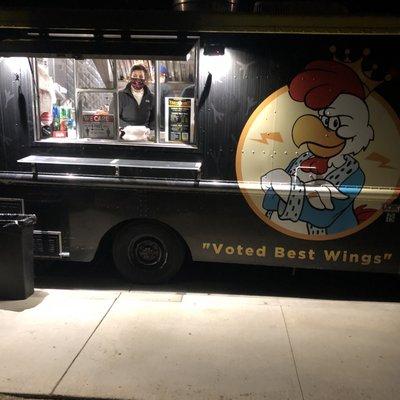 One of the owners that runs this wing truck and her family