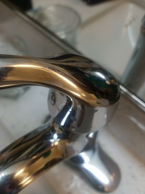 The sink handles in bathroom