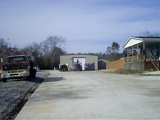 Main Shop and house seen from road at Ray's Truck Service