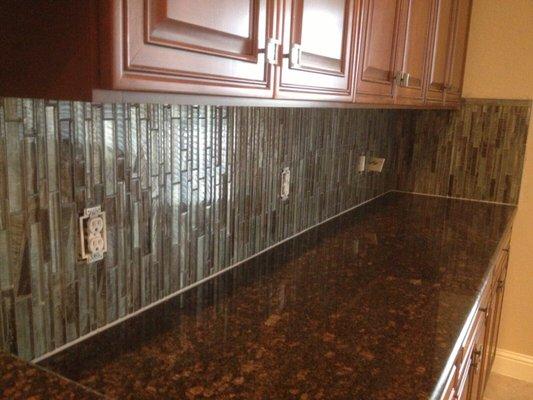 Glass tile kitchen backsplash.