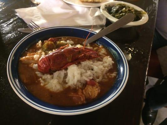 Gumbo with a crawfish, greens and corn bread