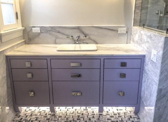 Custom Master Vanity with marble top, banana shape legs & violet lacquer finish.