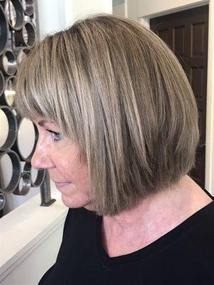 Dimensional highlights/grey coverage and transformational sassy cut!