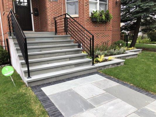 Rebuilt staircase, railings, sidewalk in bluestone