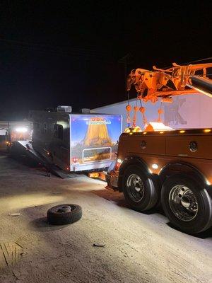 Towtruck attempted to lower the RV down and the tire came flying off