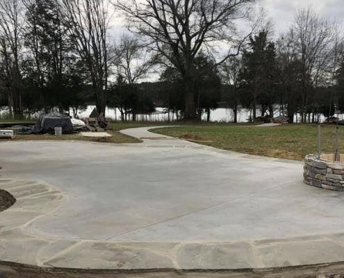 Patio and walkway to dock by Green Earth Landscape.