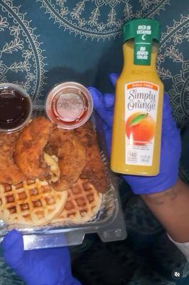 Chicken and waffles with orange juice