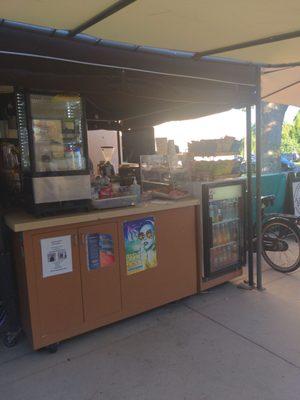 Exterior pic of Amalo's coffee cart and location tucked in by the library