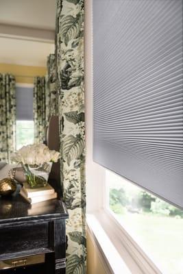 Cordless Cellular (honeycomb) shade with coordinating drapery panels.