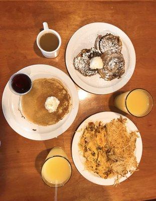 Breakfast of champions. Cinnamon roll French toast. Pancakes. Meat lover omelette with hash brown.