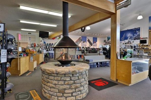 Warm up from your day on the hill, near the round stone gas fireplace