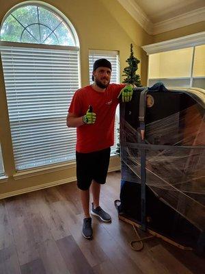 Thumbs up for a job well done on getting this piano ready to be moved!