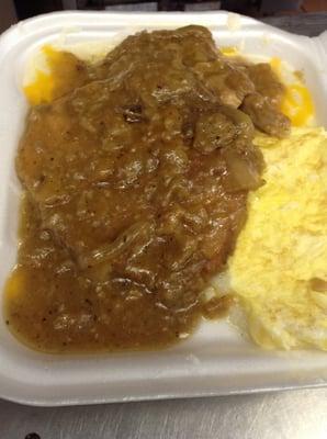 Smothered Pork a Chops, Grits, Eggs & Toast