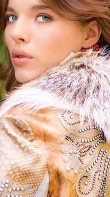 One of a kind outerwear embellished with leather and fur.