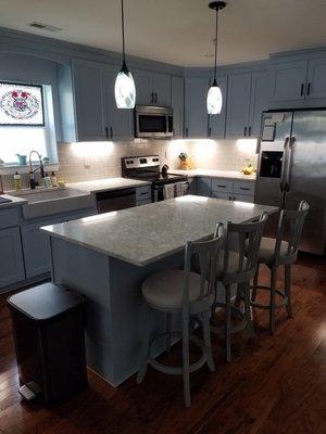 Relocated pendant lights over new island and installed new LED under cabinet lighting