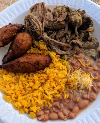 Pernil Platter (Roasted Peruvian pork over yellow Mexican rice, accompanied with refried pinto beans and fried sweet plantains)