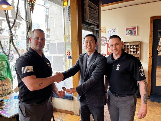 Wilkes Barre Recruiting Company Commander Viotto and First Sergeant Burgess presenting a coin to Professor Back.