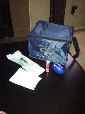 Most of my "to-go" bag: syringe, chapstick, extra gauze, and stress ball. I had already used the ice pack.