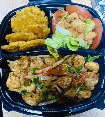 Sautéed Shrimp Platter with a side of fried plantains and a side salad.