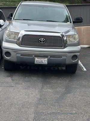 This is how's people park good luck getting out of your car in a spot you pay for because you can't even open your door