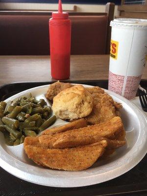 Two piece chicken with wedges and green beans.