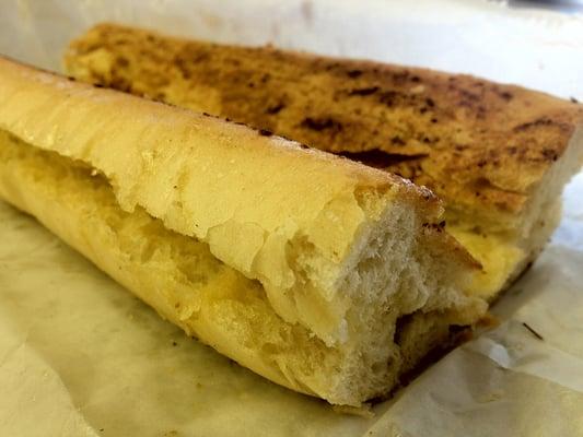 Perfectly pressed Cuban toast with garlic butter inside & out. Listen to the angels sing as you bite through its crispiness.