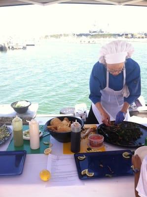 Lady making yummy rock fish and black cod sample tacos