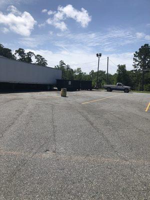 The pickup and dumpster is in the actual driveway of the wash bay making for hard maneuvering to access the bay.