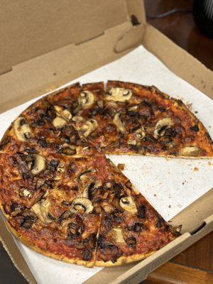 Gluten free pizza with mushrooms and onions