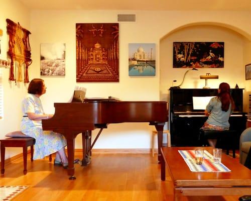 Playing duets at my student's (on the left) home.