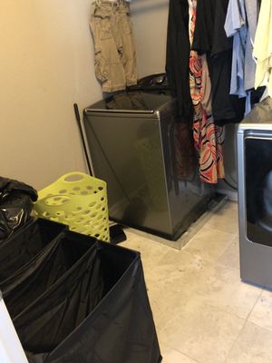 Laundry room after Hang It Up Laundry sorted, folded, and put away the pre-cleaned clothes.