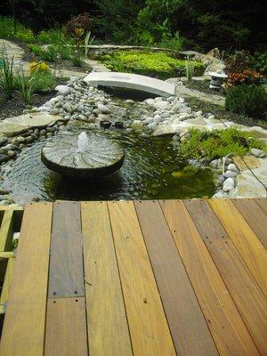 Water gardens, landscapes, and hardscapes can define a quiet space in your backyard.