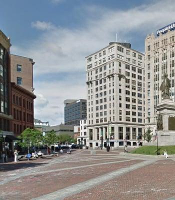 In the Time & Temp Bldg at the West End of Monument Sq.