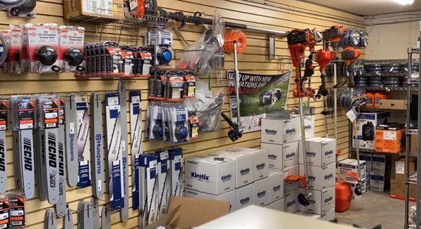 Back stock of the necessities! Plenty of chainsaw bars and fluids and equipment!