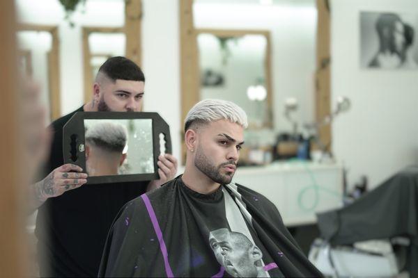 Short haircut with clean fade in the sides and texture on top for an amazing look