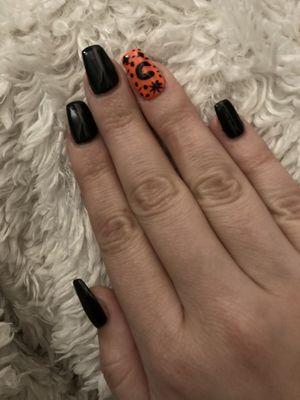 Manicure filling with design, black and "sun burnt" orange