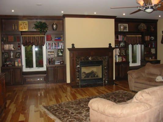 Cherry Fireplace surround with matching bookcase and window seats.