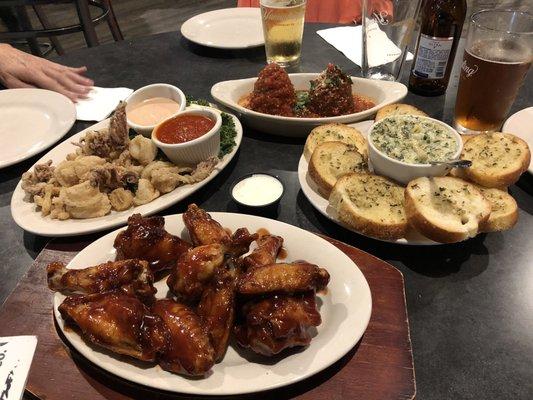 Calamari, BBQ wings, spinach artichoke dip, rice balls.